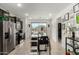 Modern kitchen with stainless steel appliances, dark cabinets, and a large center island at 40467 W Jenna Ln, Maricopa, AZ 85138