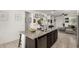 Kitchen island with barstool seating and granite countertops at 40467 W Jenna Ln, Maricopa, AZ 85138