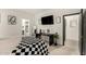 Bright bedroom with a workspace, en-suite bathroom, and walk-in closet at 40467 W Jenna Ln, Maricopa, AZ 85138