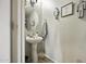 Half-bathroom featuring a white pedestal sink and decorative accents at 40866 W Sanders Way, Maricopa, AZ 85138