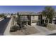 A clear view of the front exterior showcasing the front lawn and driveway at 40866 W Sanders Way, Maricopa, AZ 85138