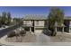 A daytime shot of the home highlighting the front exterior, landscaping, and facade at 40866 W Sanders Way, Maricopa, AZ 85138