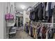 Well-organized walk-in closet with shelves, hanging rods, and ample storage at 40866 W Sanders Way, Maricopa, AZ 85138