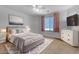 Cozy bedroom with a comfortable bed, stylish decor, and plenty of natural light, creating a serene retreat at 4455 E Palmdale Ln, Gilbert, AZ 85298