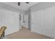 Comfortable bedroom with a murphy bed, closet, and access to the ensuite bathroom at 4455 E Palmdale Ln, Gilbert, AZ 85298
