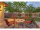 Backyard fire pit with ample seating is great for relaxing and enjoying an evening with friends and Gathering at 4455 E Palmdale Ln, Gilbert, AZ 85298