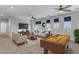 Inviting living room featuring neutral paint, ceiling fans, and plenty of space for entertaining at 4455 E Palmdale Ln, Gilbert, AZ 85298