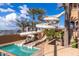 Community water park featuring multiple slides, lush tropical landscaping and a refreshing pool at 4455 E Palmdale Ln, Gilbert, AZ 85298