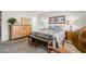 Bedroom with a queen bed, upholstered bench, dresser and carpet flooring at 4734 E Florian Cir, Mesa, AZ 85206