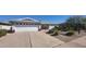 Charming single-story home with a well-manicured front yard, two car garage, and lovely desert landscaping at 4734 E Florian Cir, Mesa, AZ 85206