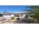 Beautiful single-story home with a well-kept yard, desert landscaping, and a spacious two-car garage at 4734 E Florian Cir, Mesa, AZ 85206
