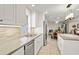 Bright kitchen with ample counter space, stainless steel appliances, and views to the living room at 4734 E Florian Cir, Mesa, AZ 85206