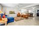 Spacious living room with tile floors, ceiling fan and comfortable seating area with views to dining and kitchen at 4734 E Florian Cir, Mesa, AZ 85206