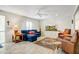 Bright living room with stylish furnishings, tile floors, and a comfortable seating area at 4734 E Florian Cir, Mesa, AZ 85206