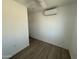 Bright bedroom featuring light walls and floors and a modern mini-split air conditioner at 5024 W Osborn Rd, Phoenix, AZ 85031