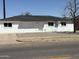 Charming single-story home featuring a fresh white paint job and desert landscaping at 5024 W Osborn Rd, Phoenix, AZ 85031