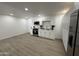 Modern kitchen with white cabinets, stainless steel appliances, and ample counter space for cooking at 5024 W Osborn Rd, Phoenix, AZ 85031