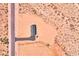 Overhead aerial view of a desert home highlighting roof detail and driveway at 50426 W Wildwood Rd, Maricopa, AZ 85139