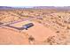 Stunning aerial view of a desert home with extensive land and nearby mountain range at 50426 W Wildwood Rd, Maricopa, AZ 85139