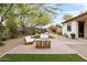 Spacious backyard patio with contemporary furniture, perfect for outdoor entertaining and relaxation at 5448 E Windstone Trl, Cave Creek, AZ 85331