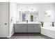 Bright bathroom features dual vanity, quartz countertop, and a separate tub at 5448 E Windstone Trl, Cave Creek, AZ 85331