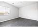 Clean bedroom with white shiplap wall, large window, and ample natural light at 5448 E Windstone Trl, Cave Creek, AZ 85331