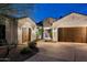 Charming home featuring a three-car garage, desert landscaping and a brick-paved driveway at 5448 E Windstone Trl, Cave Creek, AZ 85331