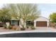 Beautiful single-story home with a three-car garage and desert landscaping at 5448 E Windstone Trl, Cave Creek, AZ 85331