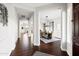 Elegant foyer featuring dark wood floors and views of the dining room with modern chandelier at 5448 E Windstone Trl, Cave Creek, AZ 85331