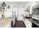 Bright, eat-in kitchen features granite countertops, stainless appliances, and white cabinetry at 5448 E Windstone Trl, Cave Creek, AZ 85331