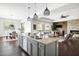Open concept kitchen with granite island overlooks living room and dining area at 5448 E Windstone Trl, Cave Creek, AZ 85331