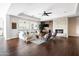 Cozy living room with a stone fireplace, hardwood floors, and stylish decor at 5448 E Windstone Trl, Cave Creek, AZ 85331
