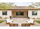 Covered patio has an outdoor seating area, desert landscaping, and a brick paver patio at 5448 E Windstone Trl, Cave Creek, AZ 85331