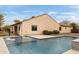 Backyard pool with in-pool lounge chairs, a waterfall feature, and desert landscaping at 5448 E Windstone Trl, Cave Creek, AZ 85331