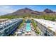 Resort-style living with a beautiful pool, mountain views, and palm trees at 5455 E Lincoln Dr # 3008, Paradise Valley, AZ 85253