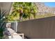 Charming balcony with comfortable seating and palm tree views at 5455 E Lincoln Dr # 3008, Paradise Valley, AZ 85253