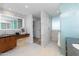 Modern bathroom with dual vanities, marble accent wall, and glass enclosed shower at 5455 E Lincoln Dr # 3008, Paradise Valley, AZ 85253