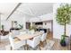 Elegant dining area adjacent to a modern kitchen and a cozy living room, offering a comfortable and stylish space at 5455 E Lincoln Dr # 3008, Paradise Valley, AZ 85253