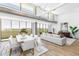 Bright dining room with large windows and a modern dining table, complemented by elegant decor and comfortable seating at 5455 E Lincoln Dr # 3008, Paradise Valley, AZ 85253