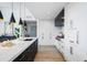 Contemporary kitchen with island, pendant lights, and modern appliances at 5455 E Lincoln Dr # 3008, Paradise Valley, AZ 85253