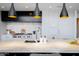 Close up of the kitchen island, stainless appliances and sleek countertops at 5455 E Lincoln Dr # 3008, Paradise Valley, AZ 85253
