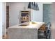 Kitchen island with seating, stainless steel appliances, and granite countertops at 5455 E Lincoln Dr # 3008, Paradise Valley, AZ 85253
