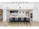 Modern kitchen features sleek island seating, stone countertops and stainless steel appliances at 5455 E Lincoln Dr # 3008, Paradise Valley, AZ 85253