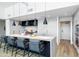 Modern kitchen with a large island, stainless steel appliances, and stylish pendant lighting at 5455 E Lincoln Dr # 3008, Paradise Valley, AZ 85253