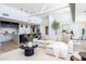 Bright open living area, showcasing a comfortable sofa, modern decor, and stylish kitchen with an island at 5455 E Lincoln Dr # 3008, Paradise Valley, AZ 85253