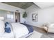 Primary bedroom with light wood floors, concrete ceilings, and a view of en-suite bathroom at 5455 E Lincoln Dr # 3008, Paradise Valley, AZ 85253