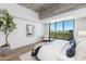 Modern primary bedroom with beautiful views and concrete accents at 5455 E Lincoln Dr # 3008, Paradise Valley, AZ 85253