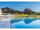 A sparkling swimming pool in front of a picturesque mountain view at 5455 E Lincoln Dr # 3008, Paradise Valley, AZ 85253