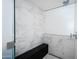 Modern walk-in shower with marble tile, seating, and stylish fixtures at 5455 E Lincoln Dr # 3008, Paradise Valley, AZ 85253