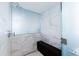Luxurious walk-in shower with marble tile, rain shower head, and bench at 5455 E Lincoln Dr # 3008, Paradise Valley, AZ 85253